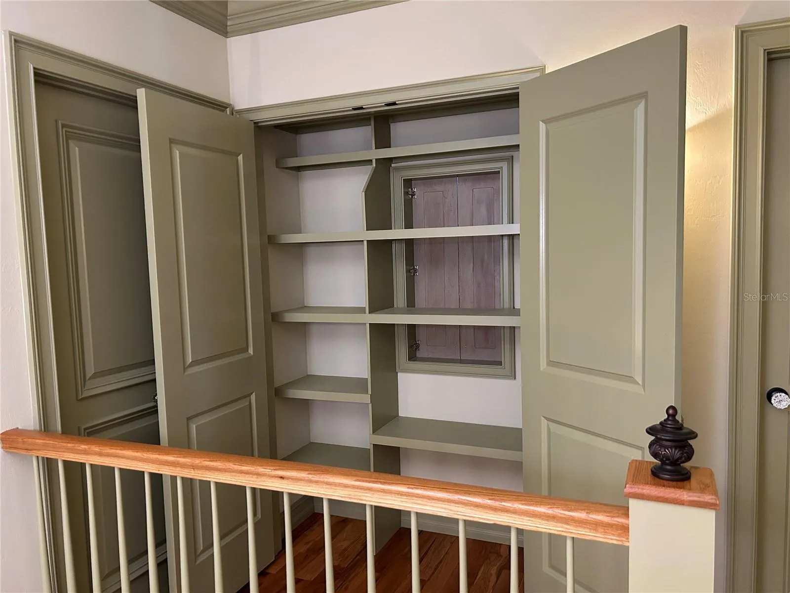 2nd floor hallway Linen Closet with custom wood shelves