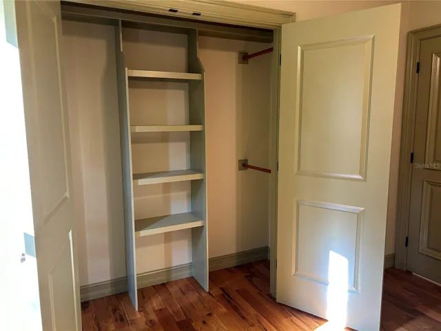 Bedroom 3 custom wood shelving