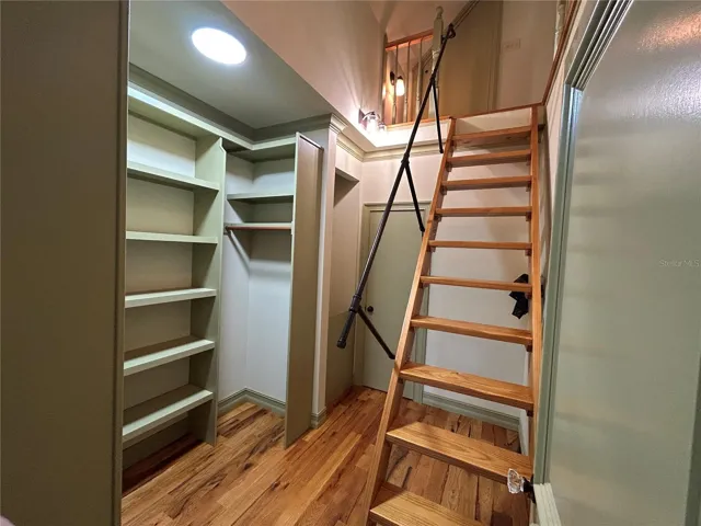 Primary Bedroom closet and access to finished attic