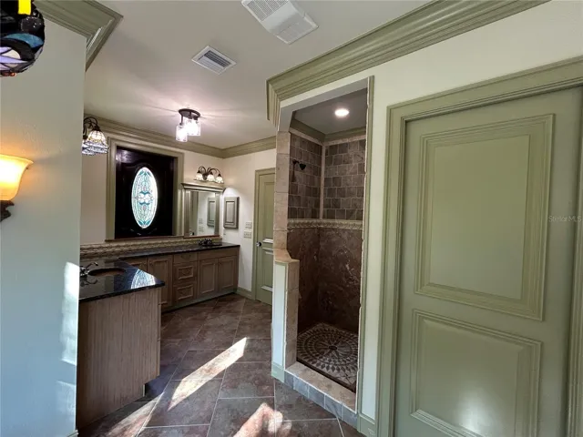 Primary Bedroom Bath with warming fan at shower entrance