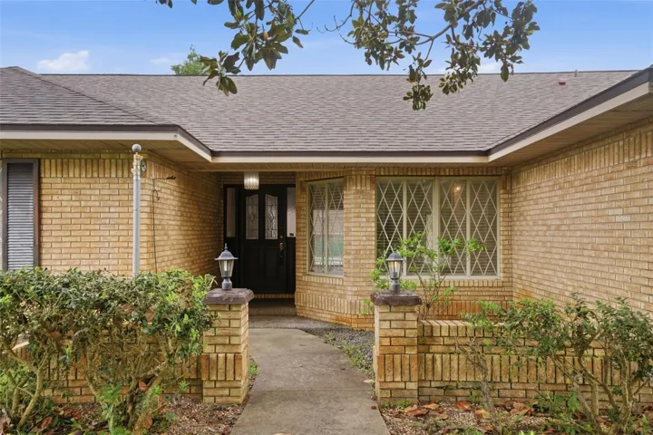 Inviting entry into this brick faced home.