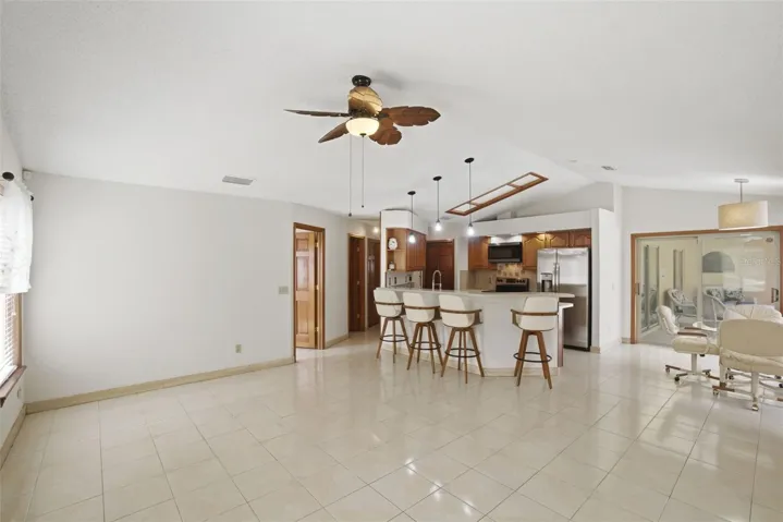 Den looking towards kitchen, breakfast nook, laundry room and 1/2 bath.