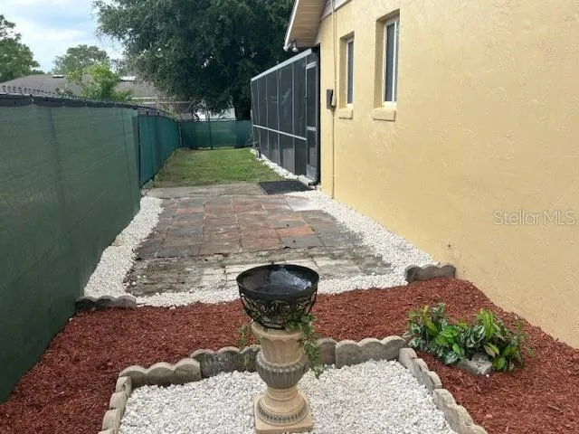 Adorable side yard garden with patio.