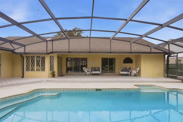 Pool deck is partially tiled and the rest of the deck was recently painted