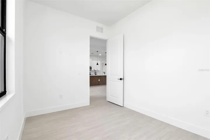 Office/Den - Room featuring light wood-finish flooring, white walls, and white trim