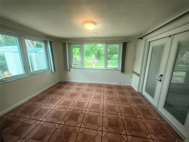 Bright Cheery Famiily Room has Hurricane Shutters and new windows