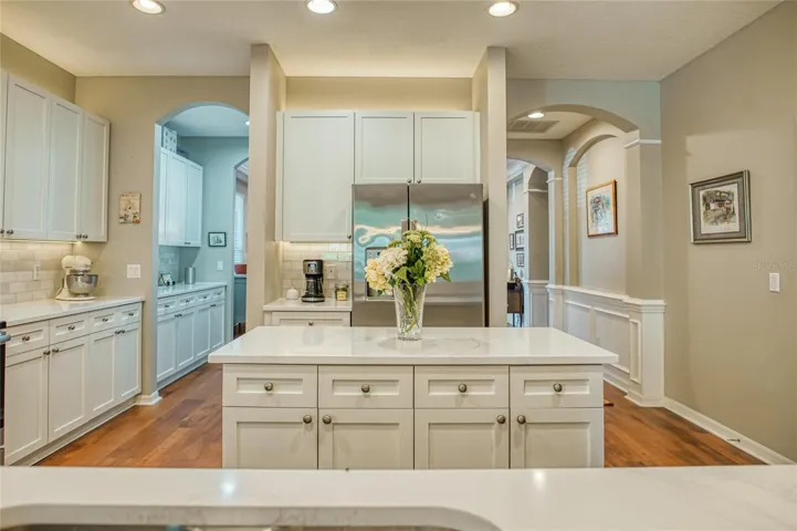 Kitchen filled with light and large pantry