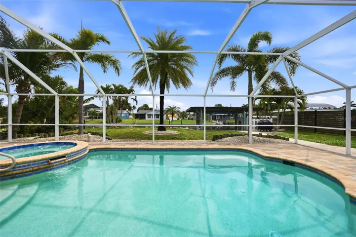 heated pool & spa overlooking the deep water canal
