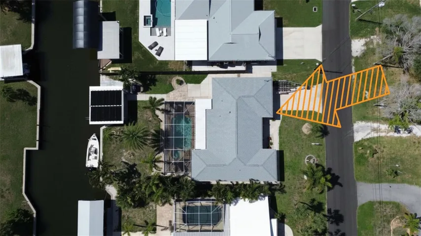 Overview of home showing wide deep canal