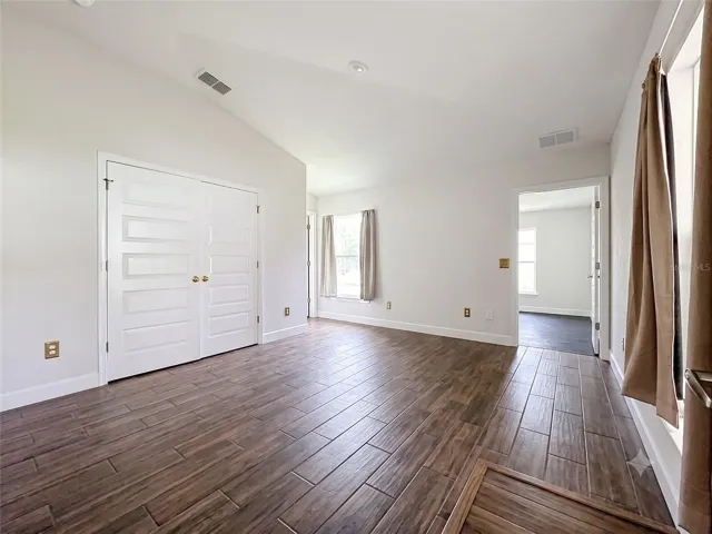 virtual staged removing carpet and placing laminated floor