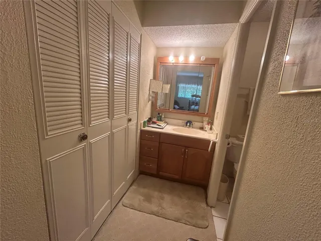Master bathroom suite with two closets