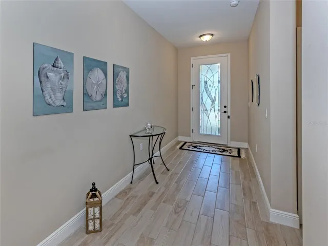 Custom glass entry into beautiful inviting foyer!