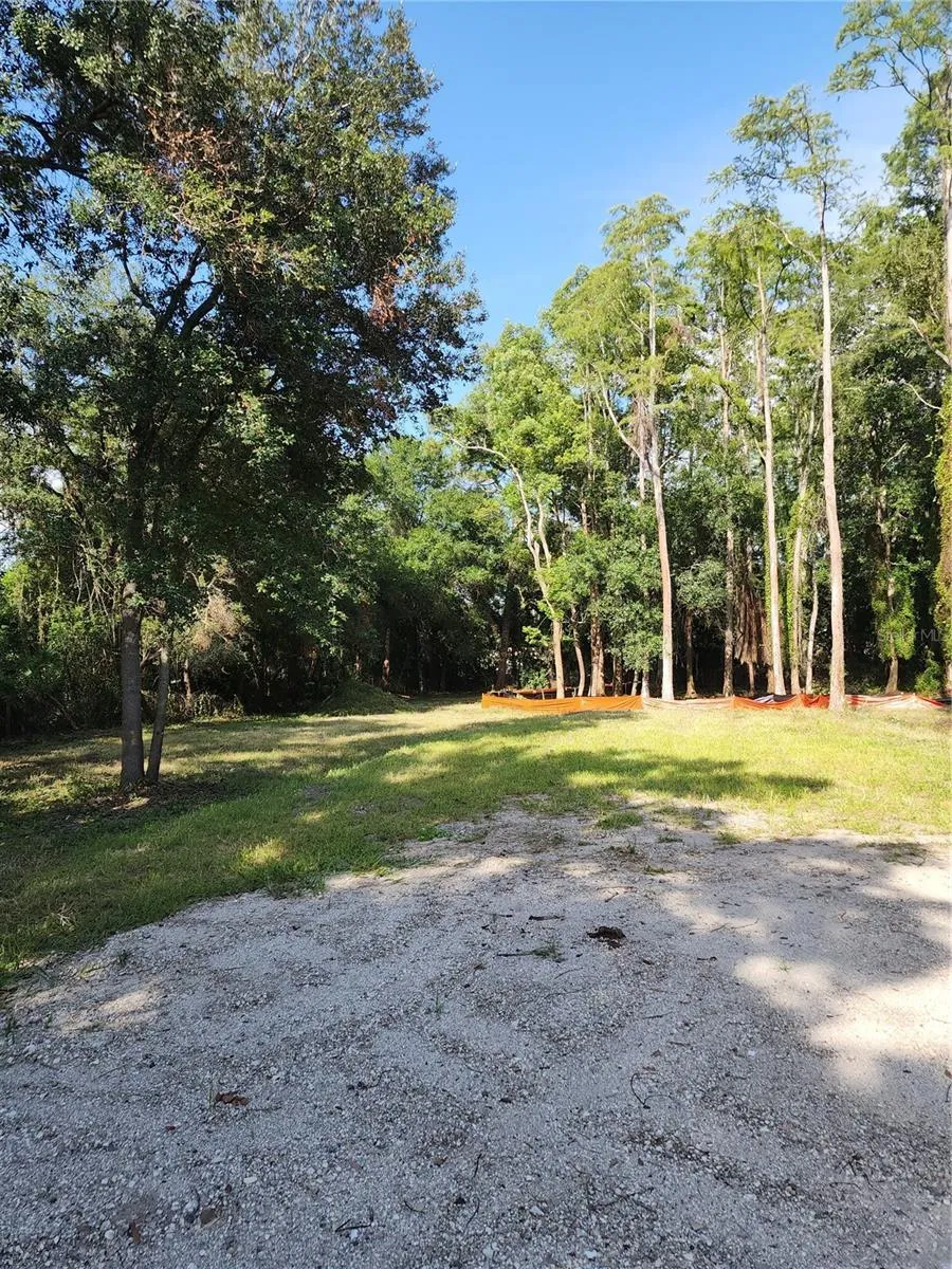 Prepared building site featuring a generous 0.4-acre upland area, providing ample space to build your dream home and enjoy the surrounding natural beauty. The elevated homesite offers a solid foundation for construction while maximizing privacy and outdoor living opportunities.