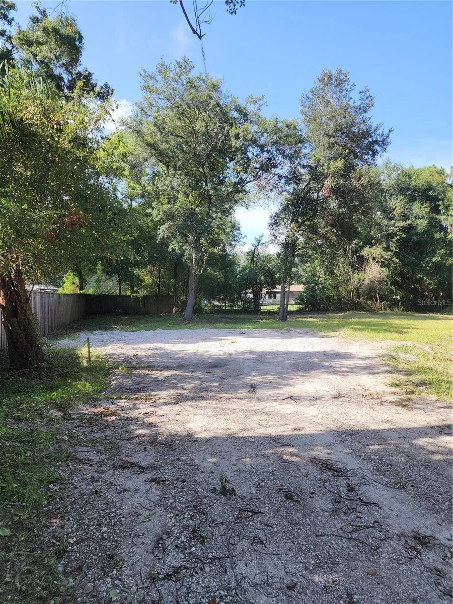 Back left corner along west property line. West property line is 264 feet long.