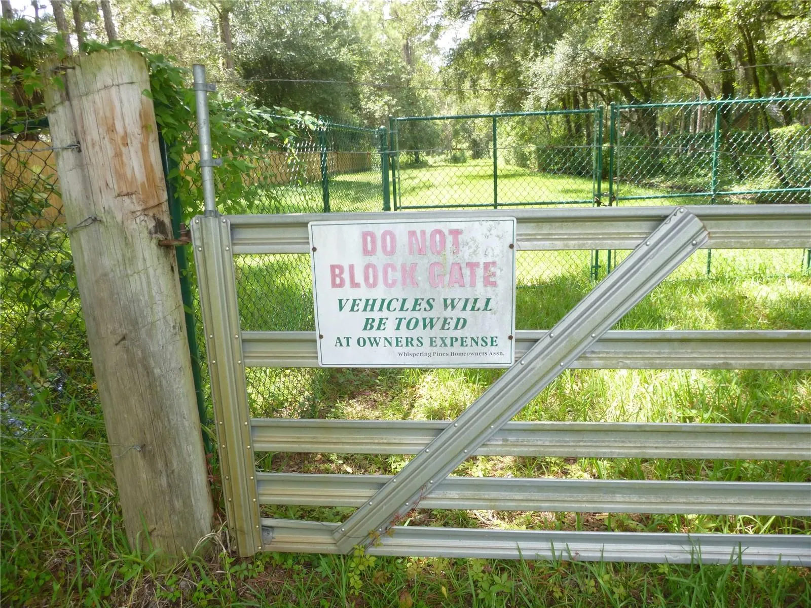 Entrance to the private 21 Acre Common Area with boardwalk to Lake Hiawatha.