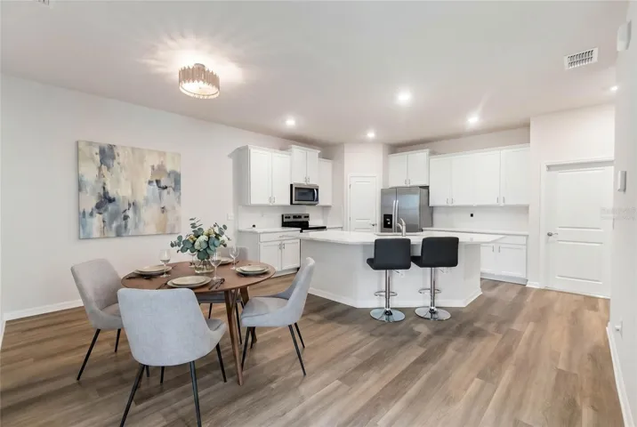 Kitchen and Dining area.  This photo has been virtually staged.