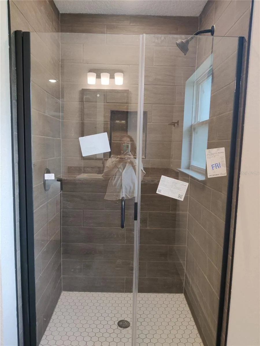 Separate walk-in tile shower in master bath