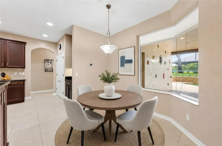 Breakfast nook overlooking the pool. Virtually Staged.