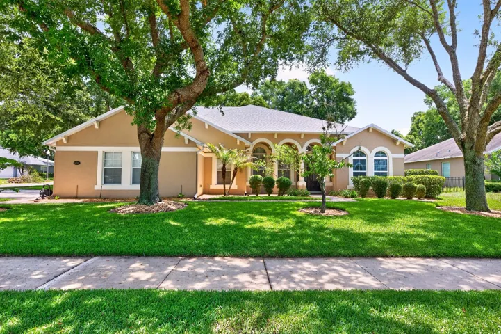 Situated on a private .35 ACRE ~ CORNER LOT with mature trees and a partially fenced backyard, this 5-bedroom, 4-bath home delivers over-the-top functionality, versatile living space, and the ideal Florida lifestyle with most of the living space conveniently located on the first floor!