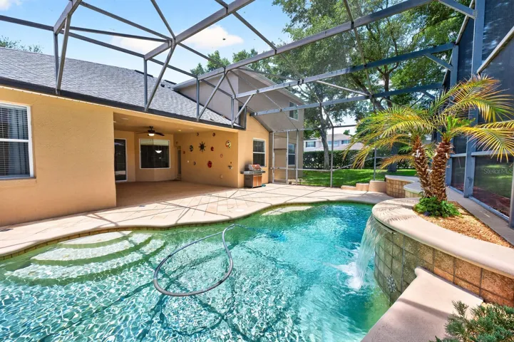 Pool is complete with a waterfall features.