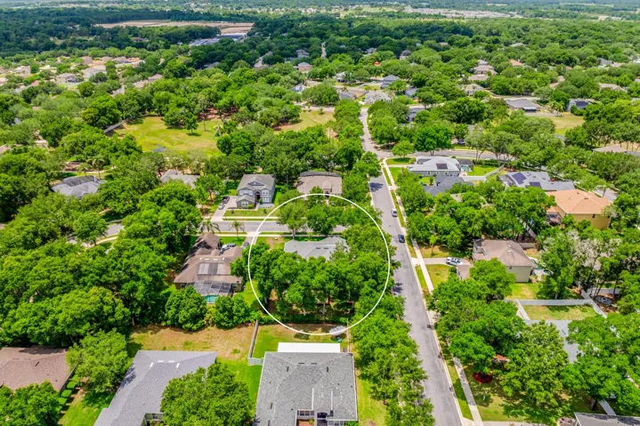 Surrounded by mature trees.