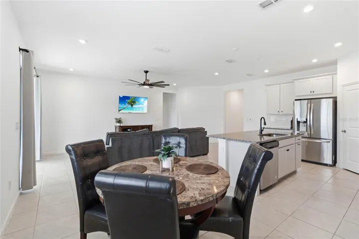 Kitchen dinette overlooking the kitchen and family room, creating an open and connected living space.