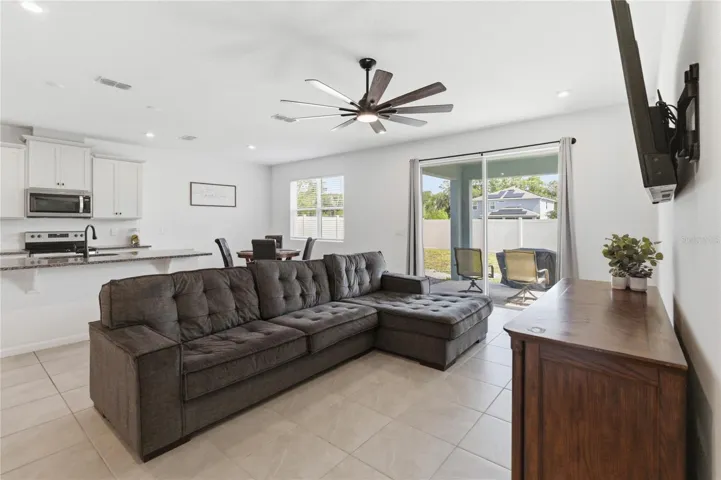 Open-concept living seamlessly connects the kitchen, dinette, and family room, creating an ideal space for everyday living and entertaining.