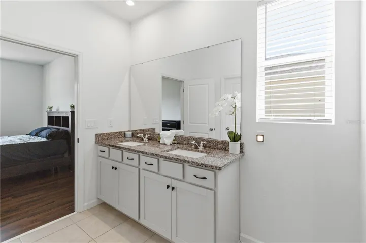 Primary bathroom featuring dual sinks for added convenience and functionality.