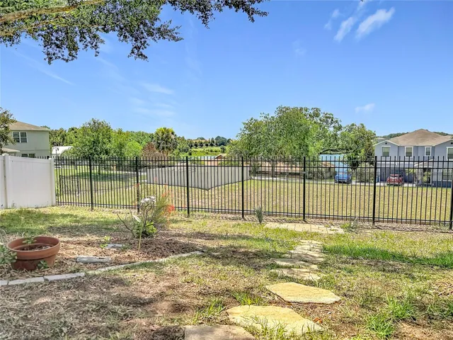 Fully fenced yard with back views of Lake Elsie.