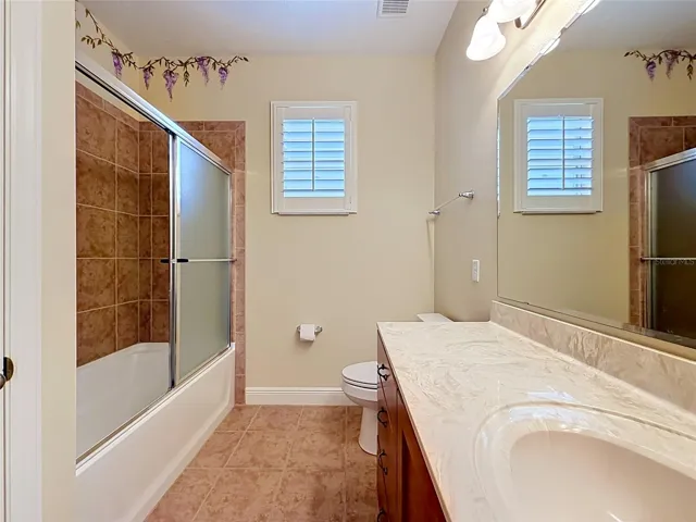 Bathroom separates Bedroom 1 and 2.