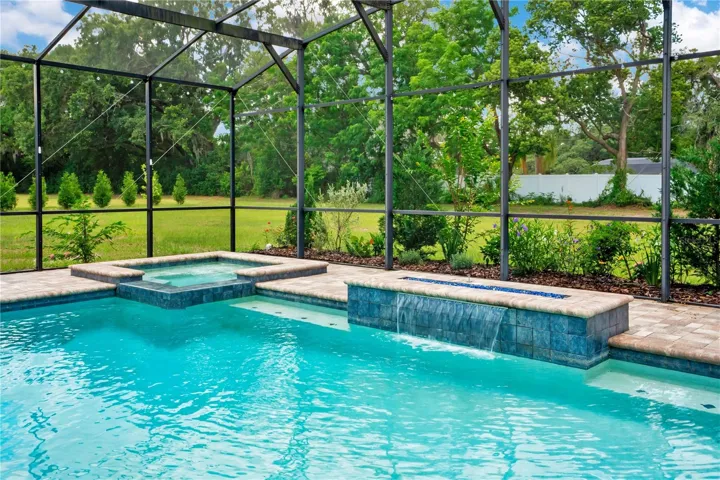 Paver Deck, Screened, Salt Water Pool and Spa, Both Gas Heated, Water and Fire Feature