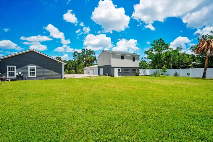 Yard view of Workshop with 2nd story apartment (2/1 with loft and kitchen..storage downstairs)