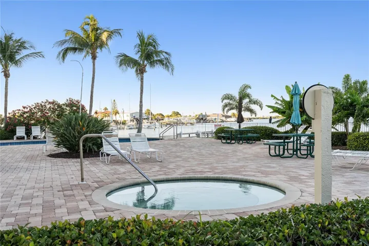 View of hot tub and pool area