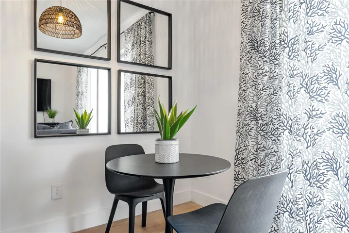 dining area and custom blackout temperature reducing drapes