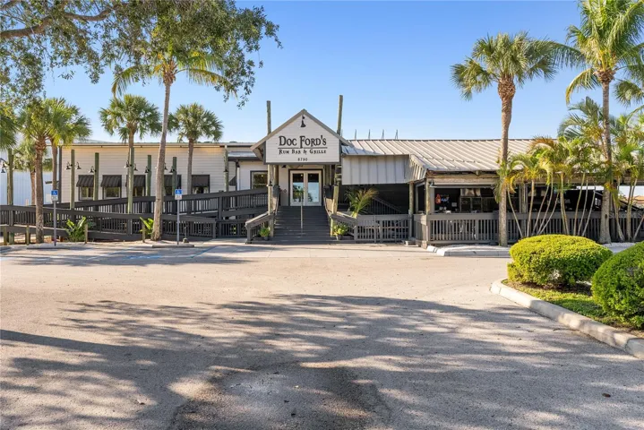 View of Doc Ford's Rum Bar & Grille restaurant in shared parking lot