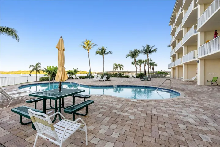 View of waterside heated pool overlooking the Boca Ciega Bay