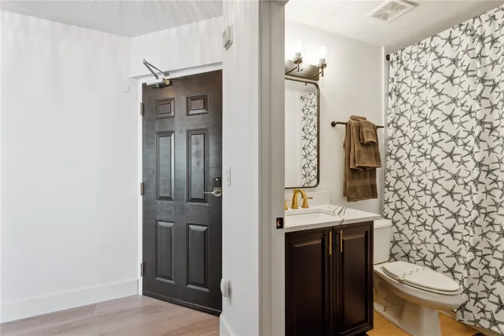 View of foyer and bathroom