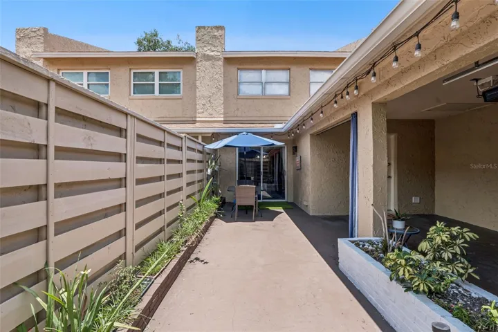 The patio also provides direct access to the ATTACHED ONE-CAR GARAGE.