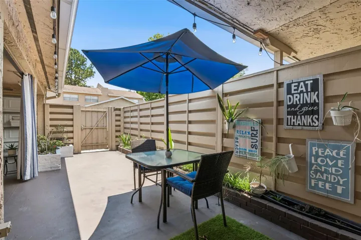 A PRIVATE FENCED PATIO creates a wonderful space for morning coffee, grilling, or relaxing evenings.