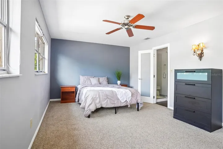 FROSTED GLASS-PANELED INTERIOR DOORS throughout the home add a modern and distinctive touch. Bedroom 2