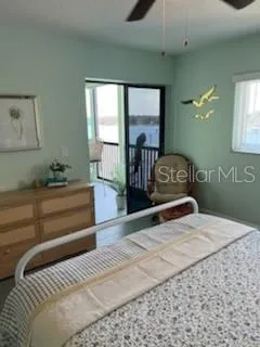Primary bedroom has door to enclosed porch
