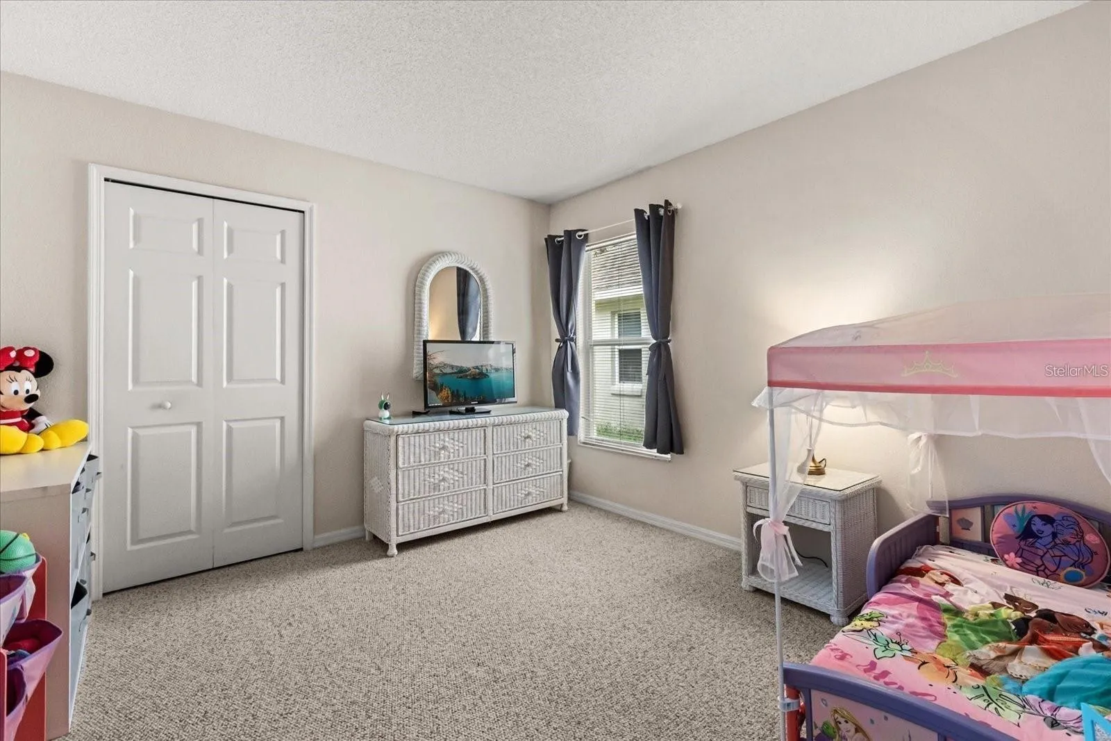 Bright secondary bedroom featuring bunk beds, ideal for family or guests