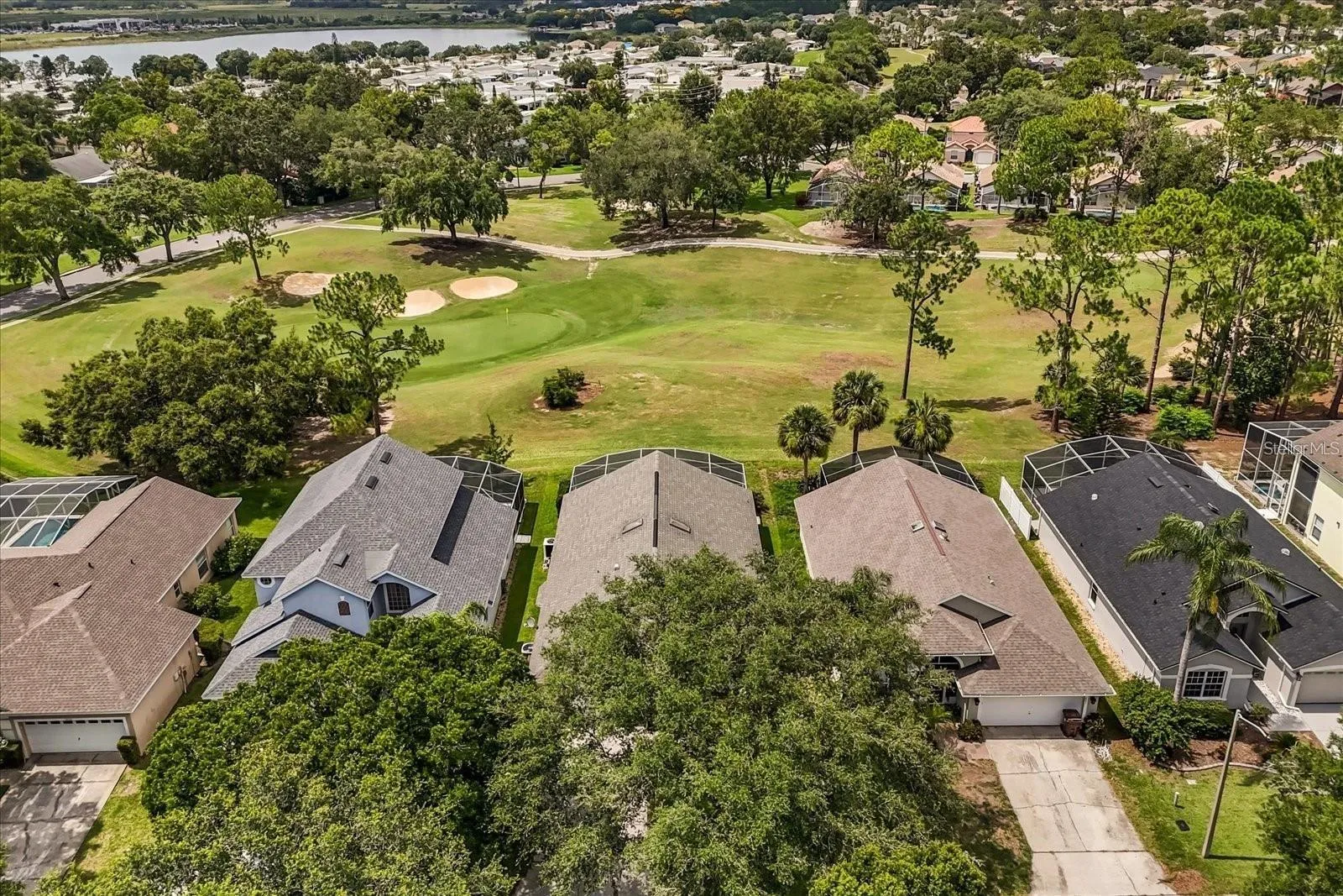 Aerial view highlighting the home's location on the golf course