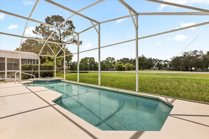 Additional pool view showcasing the spacious screened lanai