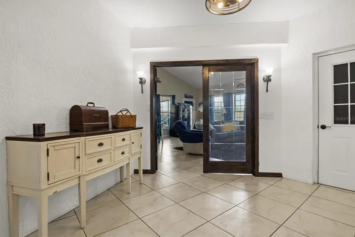 Breeze way between kitchen and bonus room