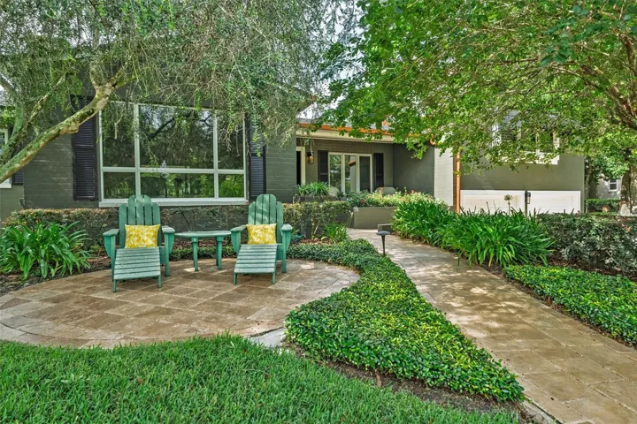 Outdoor seating areas are thoughtfully tucked among the greenery