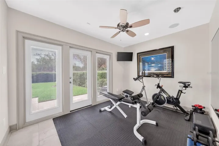 Bedroom 5 currently used as great work out room with view of backyard & French door to access