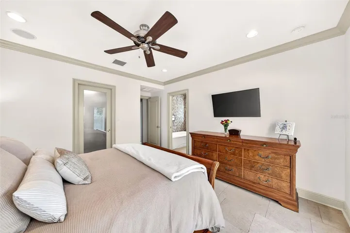 Primary features crown molding, recessed lighting and Travertine flooring