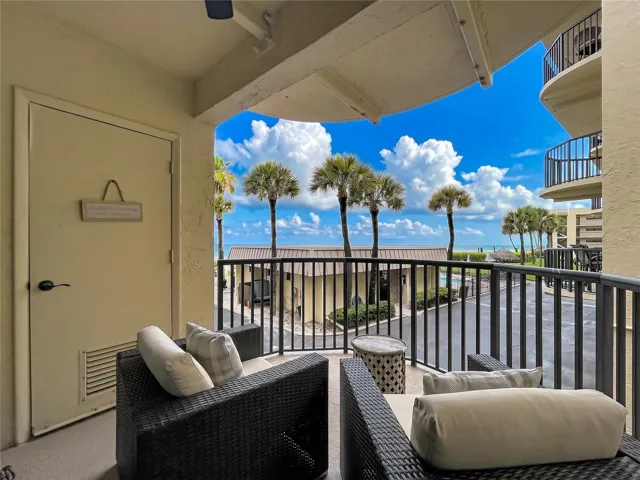 Cozy balcony with view of Clubhouse, pool and beach!