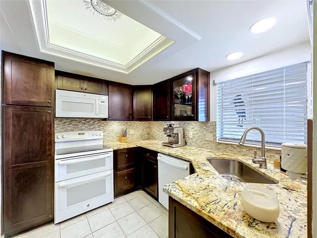 Granite tops and rich warm cabinetry
